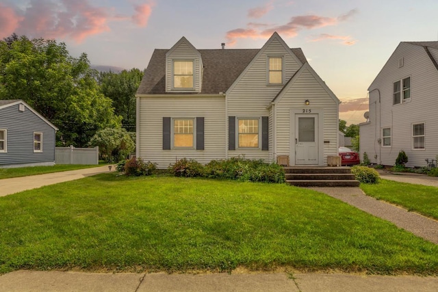215 Plainview St, Owatonna, MN 55060 - cape cod home with a front lawn and a shingled roof