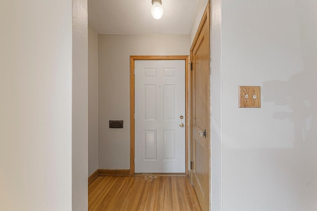 215 Plainview St, Owatonna, MN 55060 - hall with light wood-style floors and a textured ceiling