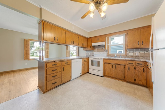 215 Plainview St, Owatonna, MN 55060 - kitchen with white appliances, under cabinet range hood, a peninsula, a ceiling fan, and decorative backsplash