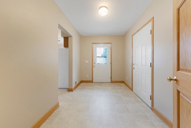 215 Plainview St, Owatonna, MN 55060 - entryway with baseboards and a textured ceiling