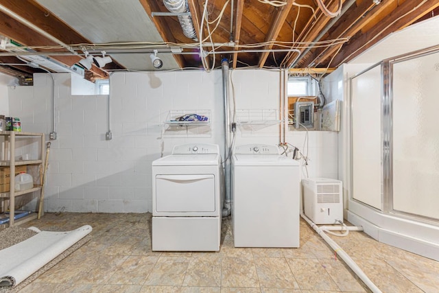 215 Plainview St, Owatonna, MN 55060 - below grade area with washer and clothes dryer, healthy amount of natural light, and electric panel