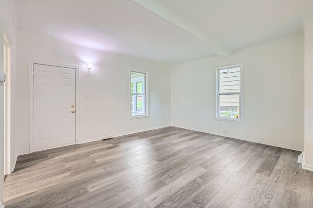 1826 Case Ave E, Saint Paul, MN 55119 - unfurnished room with wood finished floors and beam ceiling