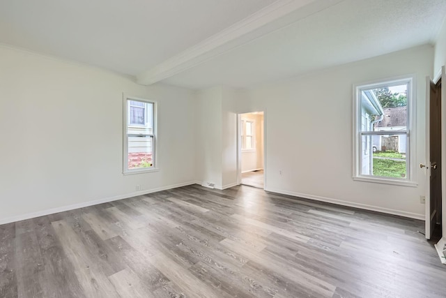 1826 Case Ave E, Saint Paul, MN 55119 - empty room with wood finished floors, beam ceiling, and ornamental molding