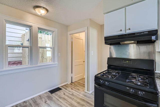 1826 Case Ave E, Saint Paul, MN 55119 - kitchen featuring gas stove, under cabinet range hood, light wood-type flooring, and a textured ceiling