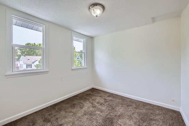 1826 Case Ave E, Saint Paul, MN 55119 - carpeted spare room with a textured ceiling and baseboards