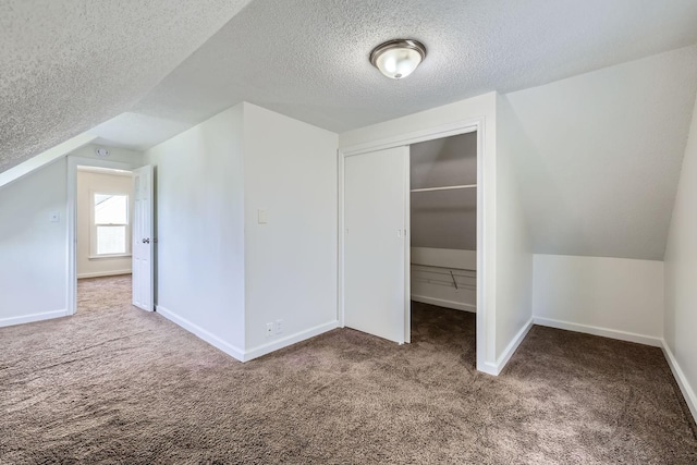 1826 Case Ave E, Saint Paul, MN 55119 - additional living space featuring carpet, a textured ceiling, and lofted ceiling