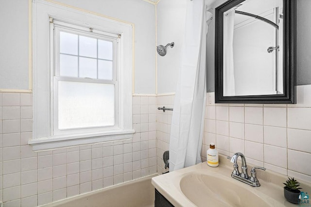 1718 Dunedin Ave, Duluth, MN 55803 - full bathroom featuring tile walls, shower / tub combo with curtain, a wainscoted wall, and vanity