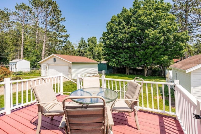 1718 Dunedin Ave, Duluth, MN 55803 - deck featuring outdoor dining space, an outdoor structure, and a garage
