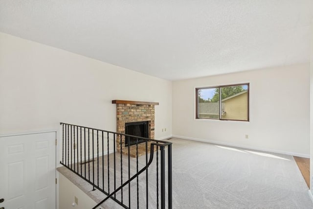 8983 Vinewood Ln N, Maple Grove, MN 55369 - unfurnished living room featuring carpet and a brick fireplace