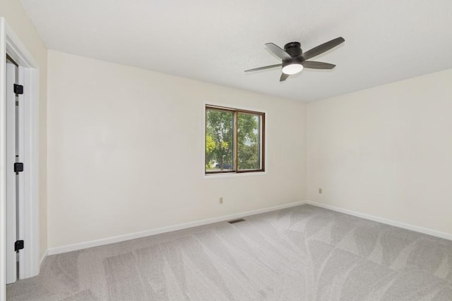 8983 Vinewood Ln N, Maple Grove, MN 55369 - spare room featuring light colored carpet and ceiling fan