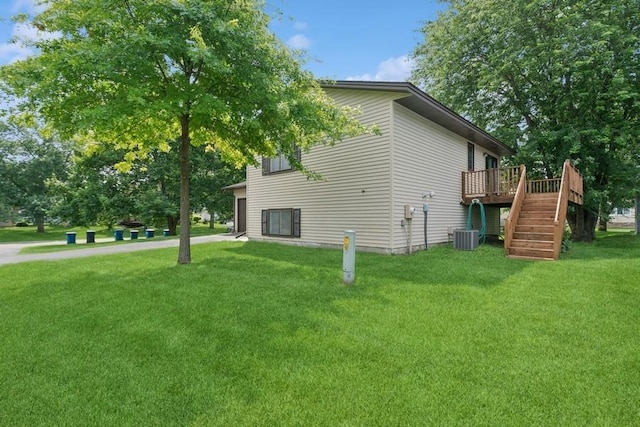 8983 Vinewood Ln N, Maple Grove, MN 55369 - view of side of home featuring a wooden deck, a yard, and stairway