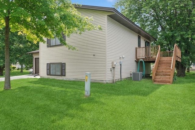 8983 Vinewood Ln N, Maple Grove, MN 55369 - view of property exterior with stairs, a deck, and a lawn