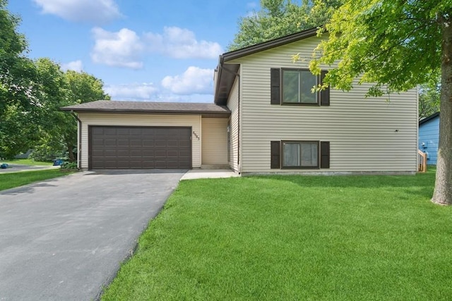 8983 Vinewood Ln N, Maple Grove, MN 55369 - split level home featuring driveway, an attached garage, and a front lawn