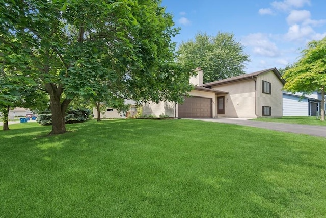 8983 Vinewood Ln N, Maple Grove, MN 55369 - view of front of property with driveway, a front yard, and a chimney