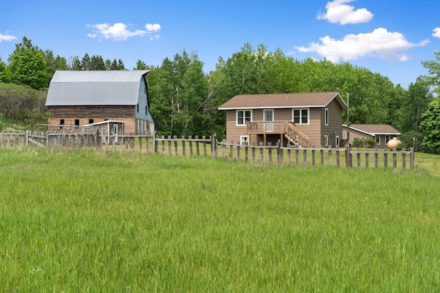 18400 Lundgren Dr, Pine Lake Twp, MN 55735 - rear view of property featuring a barn, an outdoor structure, and a wooden deck