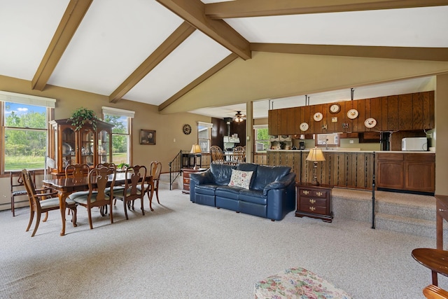 18400 Lundgren Dr, Pine Lake Twp, MN 55735 - living area featuring carpet floors, beamed ceiling, and high vaulted ceiling