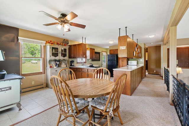 18400 Lundgren Dr, Pine Lake Twp, MN 55735 - dining room featuring baseboard heating, a ceiling fan, and light tile patterned floors