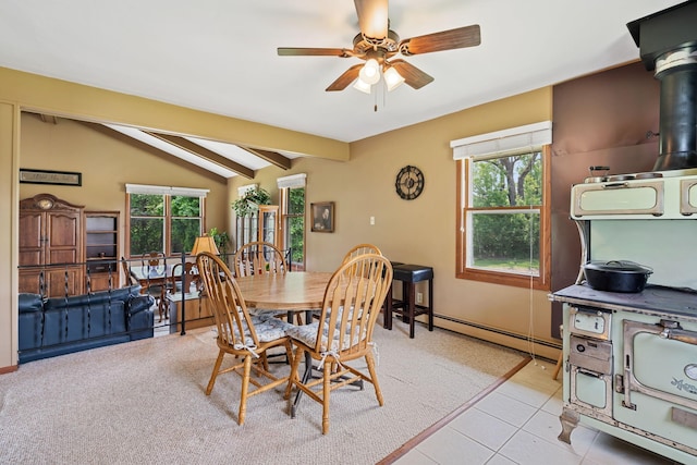 18400 Lundgren Dr, Pine Lake Twp, MN 55735 - dining area featuring ceiling fan, light tile patterned floors, a wood stove, and a baseboard heating unit