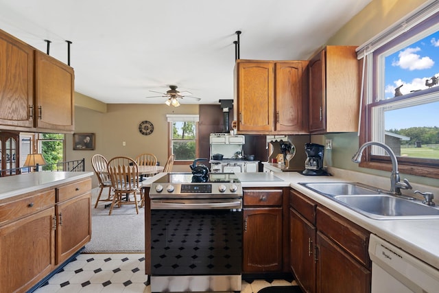 18400 Lundgren Dr, Pine Lake Twp, MN 55735 - kitchen with stainless steel electric range, dishwasher, ceiling fan, and light countertops