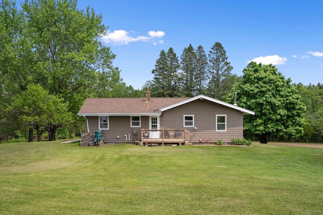 18400 Lundgren Dr, Pine Lake Twp, MN 55735 - back of house with a yard, a wooden deck, and a chimney