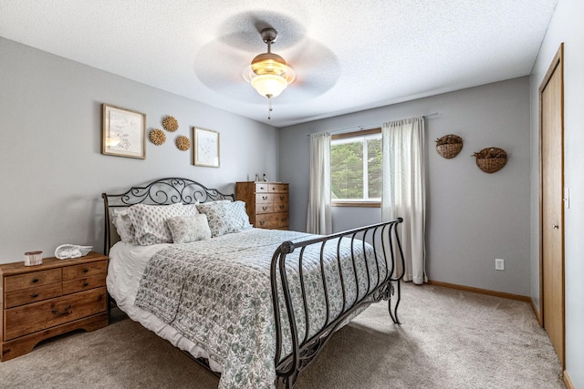 5830 Forest Boulevard Trl, Wyoming, MN 55092 - bedroom with light carpet, a closet, a ceiling fan, and a textured ceiling