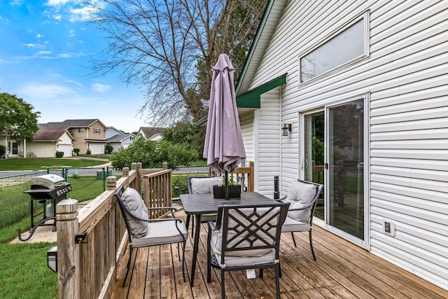 5830 Forest Boulevard Trl, Wyoming, MN 55092 - wooden deck featuring outdoor dining area, a residential view, and area for grilling