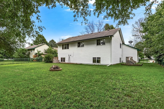 5830 Forest Boulevard Trl, Wyoming, MN 55092 - back of property featuring a fenced backyard and an outdoor fire pit