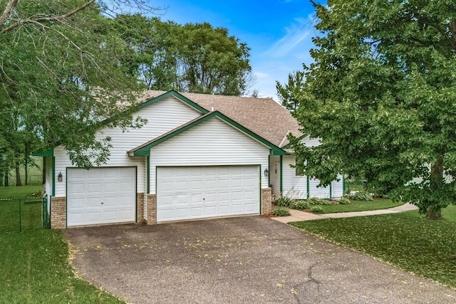 5830 Forest Boulevard Trl, Wyoming, MN 55092 - ranch-style home with brick siding, asphalt driveway, a garage, and roof with shingles