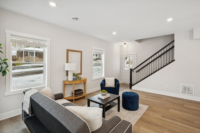 3401 Douglas Dr N, Crystal, MN 55422 - living area featuring plenty of natural light, stairs, wood finished floors, and recessed lighting