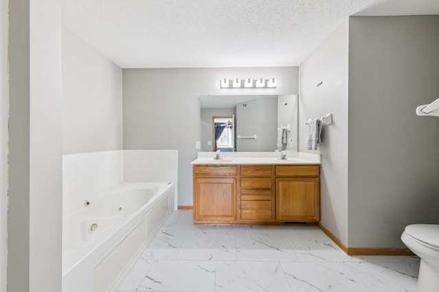 886 Coon Rapids Boulevard Extension NW, Coon Rapids, MN 55433 - bathroom featuring marble finish floors, a jetted tub, double vanity, and a textured ceiling