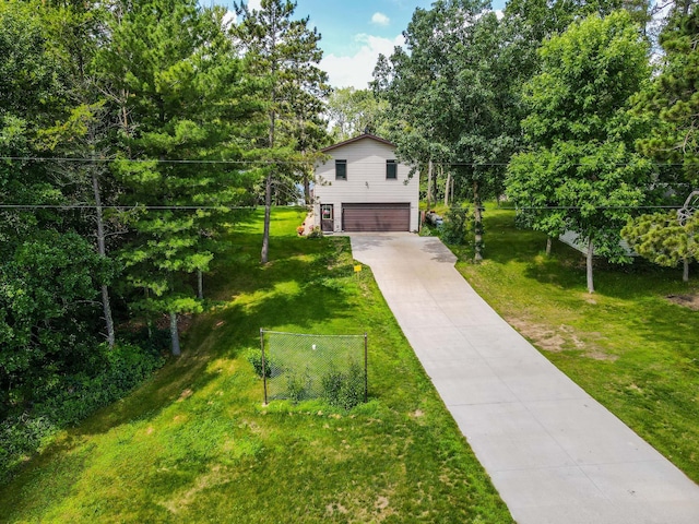31879 US-71, Park Rapids, MN 56470 - view of front of house with a garage, concrete driveway, and a front yard