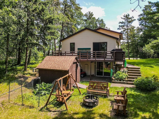 31879 US-71, Park Rapids, MN 56470 - rear view of property with a fire pit, stairs, a deck, and a shed