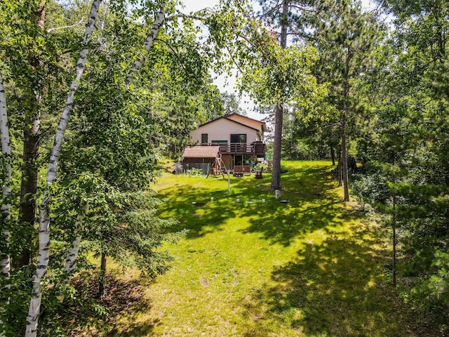 31879 US-71, Park Rapids, MN 56470 - view of green lawn with stairs and a wooden deck