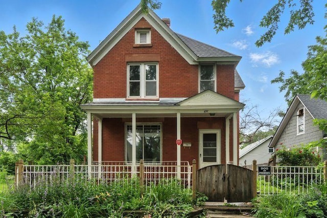 697 Tuscarora Ave, Saint Paul, MN 55102 - view of front facade featuring a porch, brick siding, and a gate