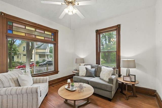 697 Tuscarora Ave, Saint Paul, MN 55102 - living area featuring hardwood / wood-style flooring, a ceiling fan, and a textured ceiling