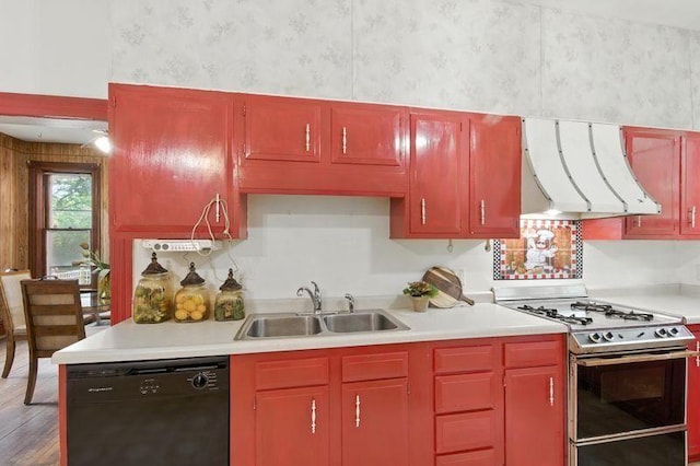697 Tuscarora Ave, Saint Paul, MN 55102 - kitchen with gas stove, dishwasher, range hood, wallpapered walls, and light countertops