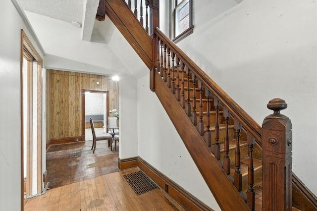 697 Tuscarora Ave, Saint Paul, MN 55102 - staircase featuring hardwood / wood-style flooring and baseboards
