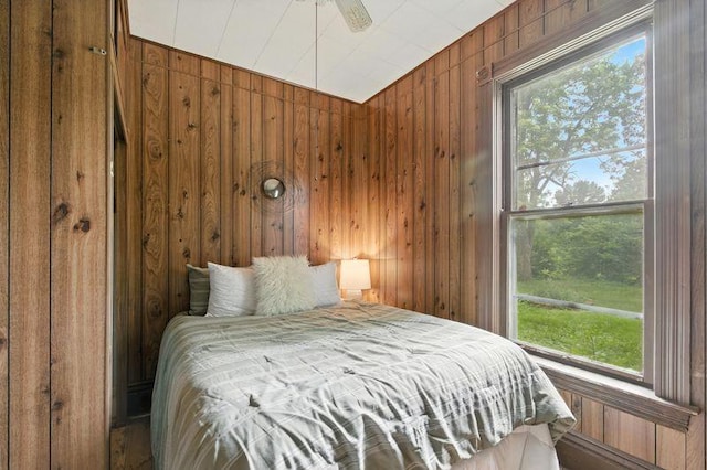 697 Tuscarora Ave, Saint Paul, MN 55102 - bedroom featuring multiple windows and wooden walls