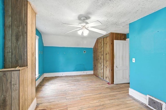 697 Tuscarora Ave, Saint Paul, MN 55102 - bonus room featuring hardwood / wood-style floors, ceiling fan, a textured ceiling, vaulted ceiling, and wood walls