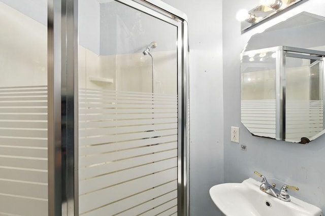 697 Tuscarora Ave, Saint Paul, MN 55102 - bathroom with a sink and a stall shower