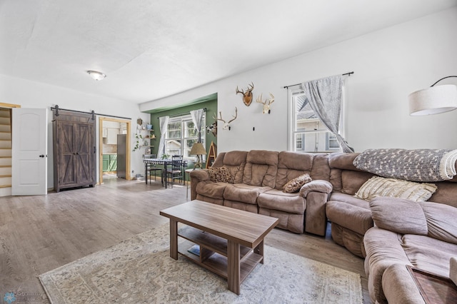 1035 University Dr N, Fargo, ND 58102 - living room featuring a barn door and wood finished floors