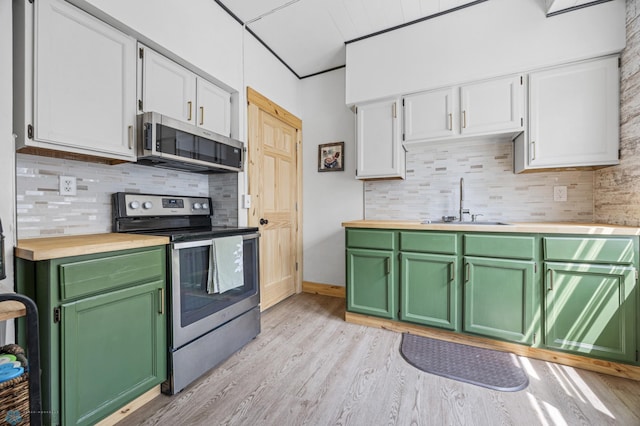 1035 University Dr N, Fargo, ND 58102 - kitchen featuring appliances with stainless steel finishes, green cabinetry, light wood-style flooring, and white cabinetry