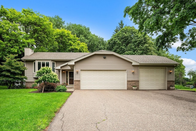 2520 Florida Ave N, Golden Valley, MN 55427 - view of front of property featuring asphalt driveway, a garage, a chimney, a front yard, and roof with shingles