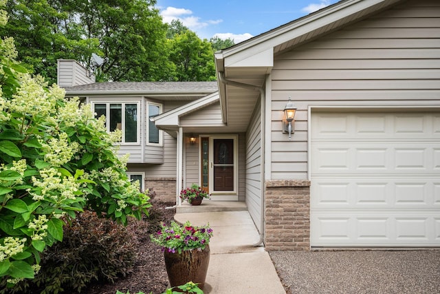 2520 Florida Ave N, Golden Valley, MN 55427 - property entrance with a garage and a chimney