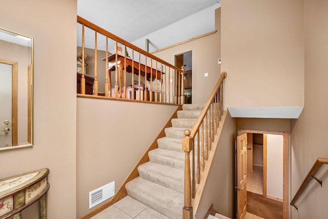 2520 Florida Ave N, Golden Valley, MN 55427 - staircase with tile patterned floors and a high ceiling