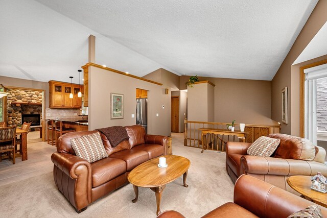 2520 Florida Ave N, Golden Valley, MN 55427 - living area featuring vaulted ceiling, light colored carpet, a textured ceiling, and a stone fireplace