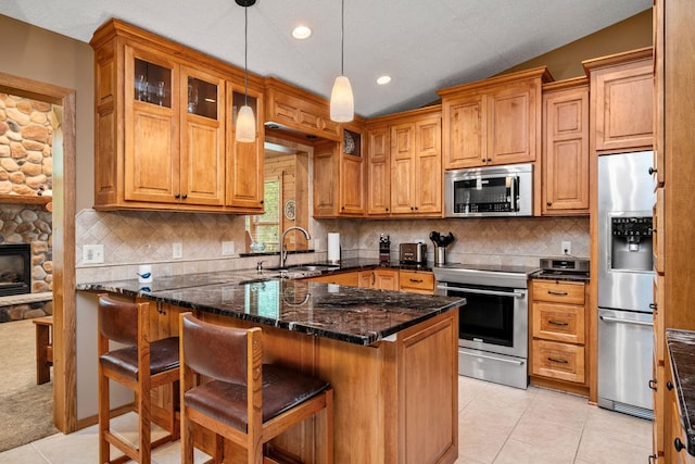 2520 Florida Ave N, Golden Valley, MN 55427 - kitchen featuring stainless steel appliances, a peninsula, a kitchen breakfast bar, glass insert cabinets, and light tile patterned floors