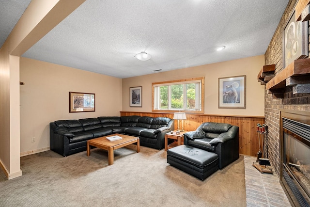 2520 Florida Ave N, Golden Valley, MN 55427 - living area featuring a textured ceiling, a wainscoted wall, light colored carpet, a brick fireplace, and wood walls