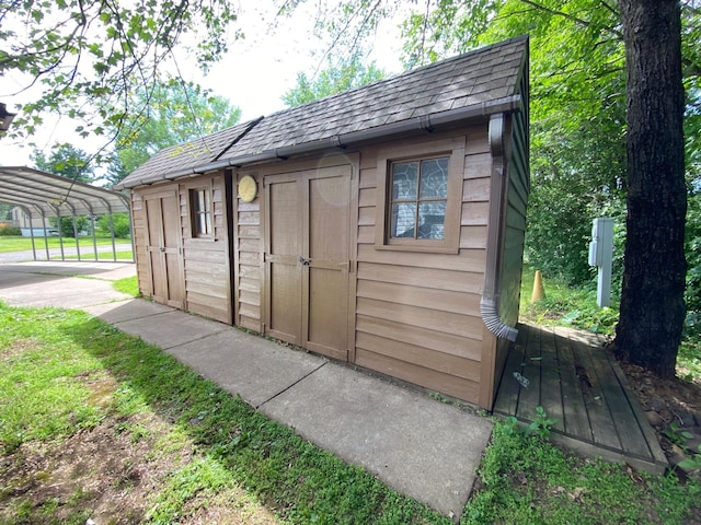 225 Jay St Unit 12, Sandstone, MN 55072 - view of shed with a detached carport