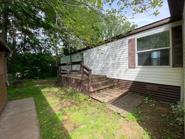 225 Jay St Unit 12, Sandstone, MN 55072 - view of green lawn with a wooden deck